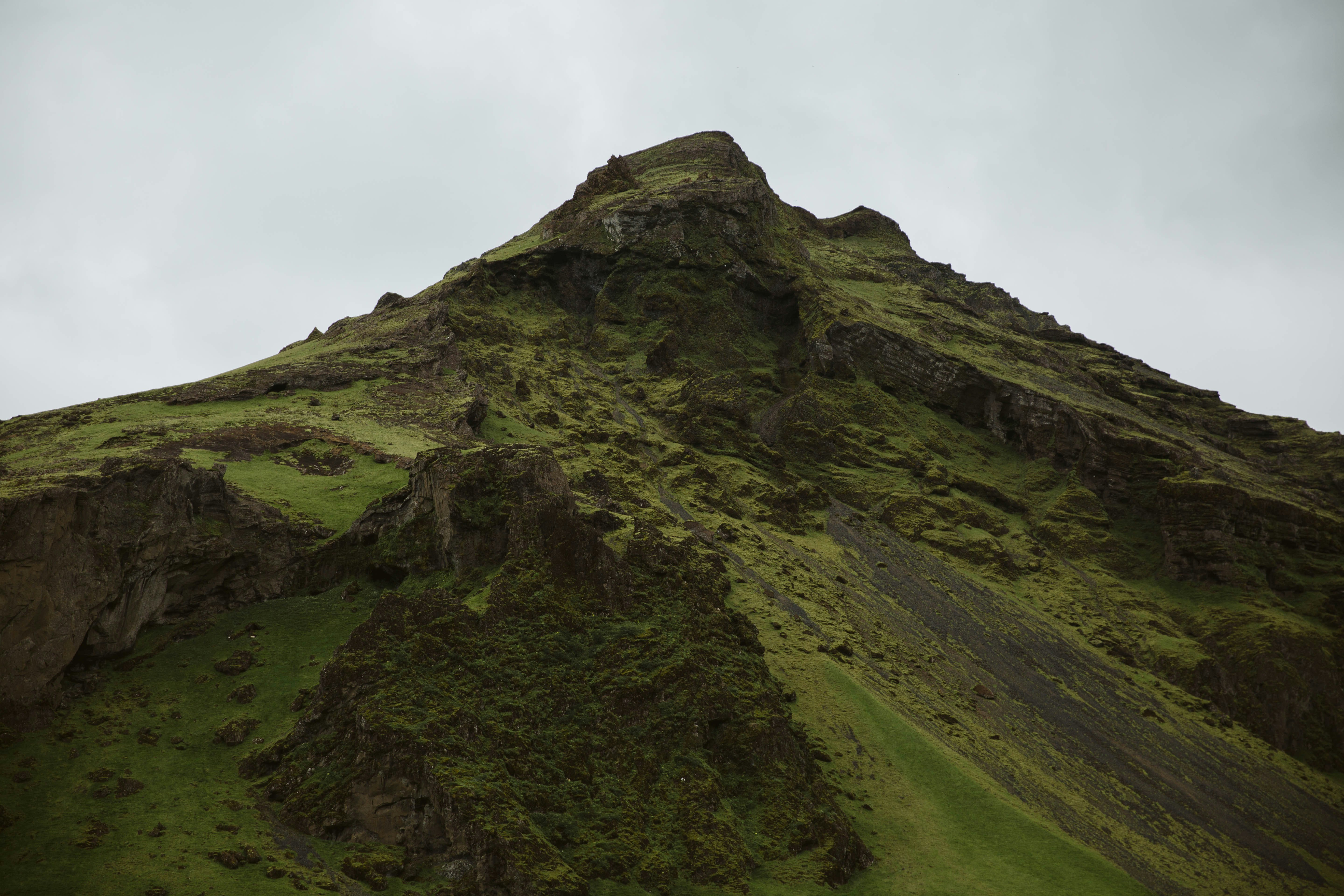 green mountain under white sky during daytime